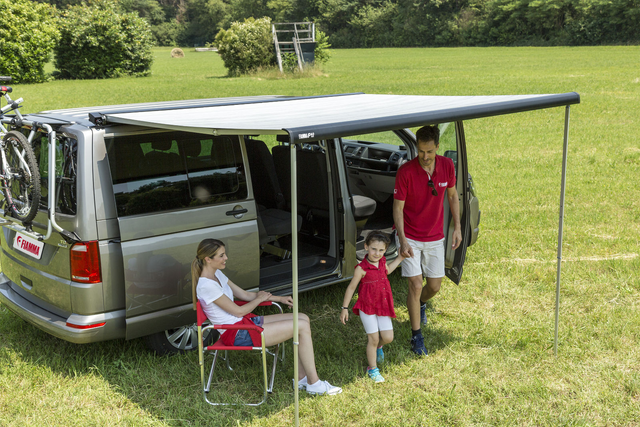 Fiamma F40van awning extended on a VW Transporter campervan – family lifestyle shot